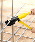 Heavy Duty 22mm Hydraulic Rebar Cutter With Sturdy Steel Toolbox For Construction Sites handheld tool cutting steel rebar on site.