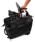 Person placing camera into Cineluxe V2 Backpack 24 for Pro Cinema Gear fits camcorders up to 20 inches with doctor bag opening