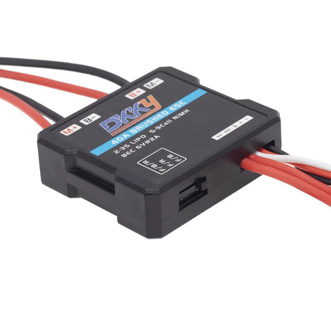 Brushed RC ESC 40A Speed Controller For 1 By 16 1 By 18 1 By 24 RC Crawlers AX24 FCX24 FCX18 Delivers Smooth Power Supports 2 To 3S LiPo Or 4 To 9 NiMH Batteries Great For Rough Terrain And Precise Throttle In Off Road Drives, front angle view with wires visible.