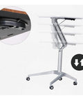 Plug And Play Adjustable Laptop Desk Featuring A Rock Solid Portable Rolling Stand with height adjustment feature and smooth casters.