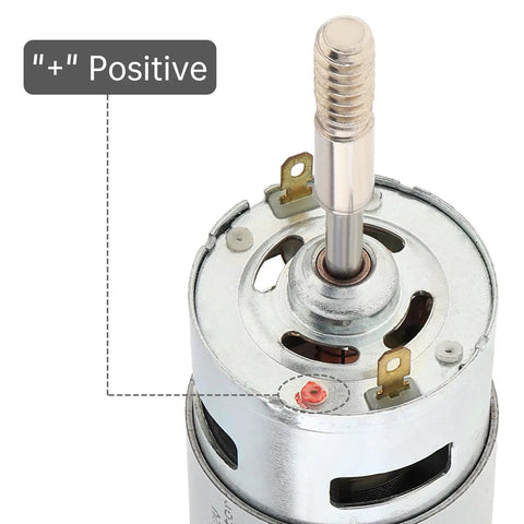 RS775 DC Motor 12V 3000 RPM dual output long shaft with positive terminal marked in close-up view