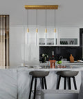 4 Light Gold Brass Pendant Light Fixture For Kitchen Island Modern Dimmable LED Bulbs above marble countertop in stylish kitchen.