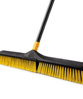 Heavy Duty 24 Inch Push Broom With Adjustable Telescoping Handle Up To 65 Inches featuring yellow bristles and ergonomic grip for easy use.