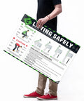 Man holding OSHA Compliant Lifting Safety Poster 18x24 Inches Waterproof Tear Resistant Manual Handling Sign for warehouses.