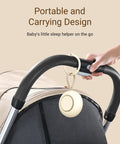 On The Go Baby Sleep Sound Machine With 12 Soothing White Noise Tracks USB Recharge 15 Hour Battery Life hanging on stroller