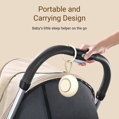 On The Go Baby Sleep Sound Machine With 12 Soothing White Noise Tracks USB Recharge 15 Hour Battery Life hanging on stroller