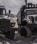 Two RC trucks on rocky terrain with silver and black RC body clips scattered around, showcasing Premium Universal RC Body Clips 120 Pieces Stainless Steel RC Clips Set For 1 To 10 And 1 To 12 Scale RC Cars Trucks Buggies Shell Replacement Silver And Black Durable Heavy Duty.