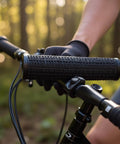 Close-up of Two Pack MTB Handlebar Grips For Twisting Shifter, Shock Absorbing Anti Slip Rubber Grips on a mountain bike in a forest setting