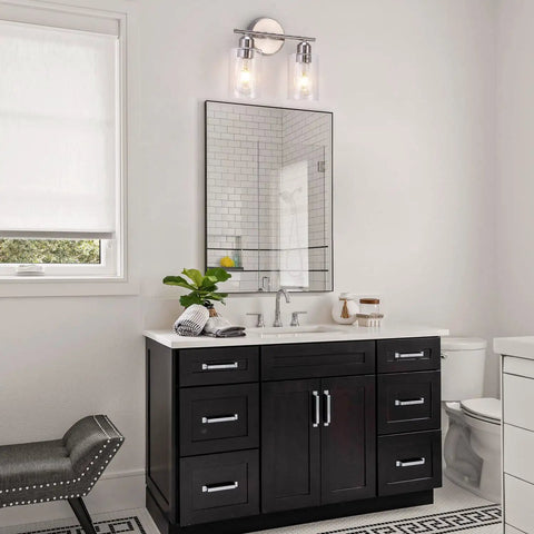 Bathroom with two light brushed nickel bathroom vanity light with clear glass shades above mirror, modern decor