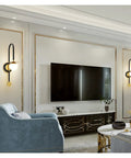 Smooth Matte Iron Wall Lamp Serving Prime Glareless Bedside Reading Glow With Quick Three Color Toggle on a living room wall.
