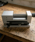 Precision Swivel Vise Machine Workholding Clamp With Graduated Rotation And Secure Jaw For Accurate Fixturing Perfect For CNC Milling Grinding Shop Operations 3 Inch Size on a wooden bench.