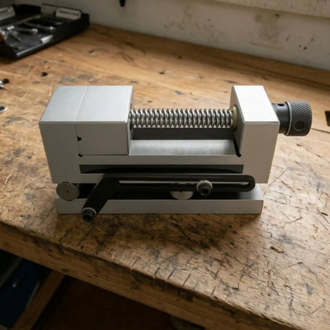 Precision Swivel Vise Machine Workholding Clamp With Graduated Rotation And Secure Jaw For Accurate Fixturing Perfect For CNC Milling Grinding Shop Operations 3 Inch Size on a wooden bench.