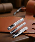 Pro Grade Leather Punch Set With Steel Hollow Punches, featuring three grommet sizes on leather backdrop