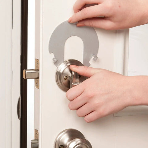 Kid Proof Deadbolt Lock With Secure Mount No Drilling Or Adhesives being installed on a door, fits under two inches wide deadbolts.