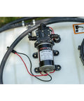 Close-up of the diaphragm pump and hoses on the Tow-Behind Garden Sprayer With 15 Gallon Tank, 30 Inch Boom, 1.6 GPM At 100 PSI