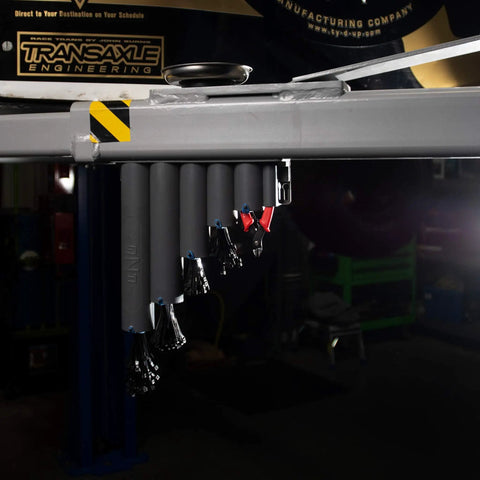 Magnetic Base Cable Tie Organizer With 250 Zip Ties And Cutter mounted on metal beam, showing magnetic holders in a garage shop.