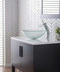 Tall Waterfall Vessel Sink Faucet With Frosted Glass Disk And Pop Up Drain Chrome Finish on modern bathroom counter