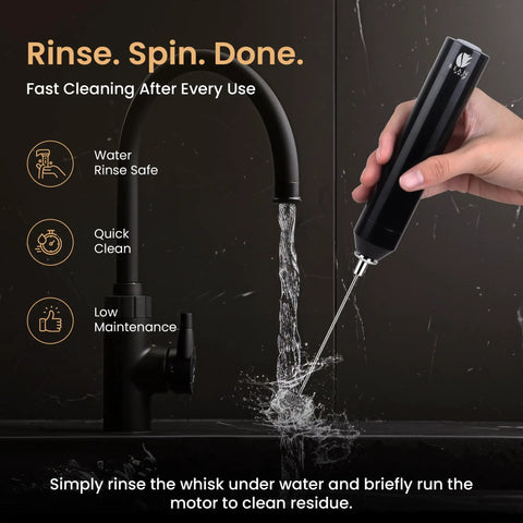 Rechargeable Milk Frother Handheld With Aluminum Body And Stainless Steel Wand being cleaned under running water