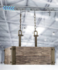 Installed Four Wheel Unistrut Trolley Assembly Kit with Silent M10 Bolt and Nuts on 1-5/8 inch Strut Channel, lifting a wooden box.