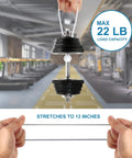 Demonstration of Six Inch White Ball Bungee Cords 50 Pcs Heavy Duty Tarp Ball Bungee Ties stretching to 13 inches in gym setting.