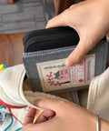 Person placing DIY Embroidery Stitch Book Kit With 106 Illustrated Stitches into a bag, showing portability and easy storage