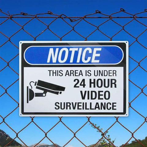 4 Pack Aluminum Security Notice Signs 14 By 10 Inches UV Printed This Spot Is Under 24 Hour Video Surveillance Signs Durable Warning For Home Office And Business Safety installed on fence