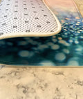 Premium Heavy Duty Polyester Kitchen Sink Dish Drying Mat With Ultra Absorbent Quick Dry Pads angled view on marble countertop.