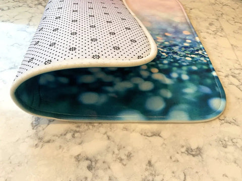 Premium Heavy Duty Polyester Kitchen Sink Dish Drying Mat With Ultra Absorbent Quick Dry Pads angled view on marble countertop.