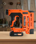 Real Deal Power Tool For Weekend Warriors Knocking Out Home Builds This Cordless 2 In 1 Brad Nailer And Staple Gun side view on a wooden surface.