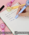 Hand using Correction Tape Pen Set 10 Pack With 0.2 Inch Tape Width And 293 Inch Length Bright Colors Must Have Pen Style Applicators in notebook