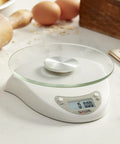 Digital Kitchen Scale With Glass Platform, Tare Button, White Plastic Body, 11 Lb 5 Kg Capacity on kitchen counter.