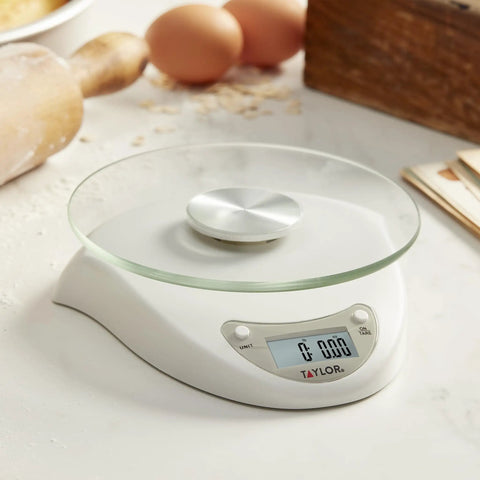 Digital Kitchen Scale With Glass Platform, Tare Button, White Plastic Body, 11 Lb 5 Kg Capacity on kitchen counter.