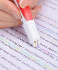 Hand using red Dual Color Highlighter Pens Set With One Stroke Two Colors 6 Vibrant Inks 3 Curve Shapes Acid Free No Bleed on text