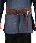 Snag This Premium Vintage Embossed Waist Belt Adjustable Faux Leather Cinch Strap For Medieval Festival Costumes worn over blue tunic.