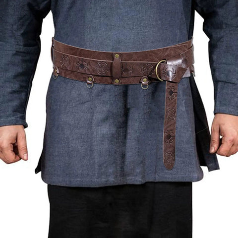 Snag This Premium Vintage Embossed Waist Belt Adjustable Faux Leather Cinch Strap For Medieval Festival Costumes worn over blue tunic.