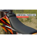 Side view of MX500 Dirt Rocket Electric Ride On Bike with padded seat, red body, designed for teens ages 14 and up