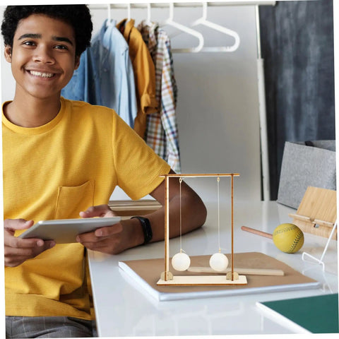 Boy with 2-Pack Kid-Friendly Physics Principles Experiment Kit for Hands-On STEM Learning on desk in room