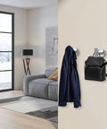304 Stainless Steel Towel Hooks And Robe Hooks Wall Mounted With Brushed Nickel Finish in modern living room, holding clothes