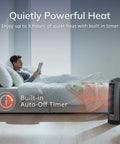 Man relaxing with an oscillating digital ceramic tower space heater providing even warmth in a bedroom, silver finish