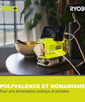 Compact Cordless Rotary Tool With 4V USB Lithium Battery And Variable Speed Control resting on a table charging a phone.