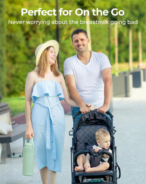 Game Changer In Your Diaper Bag Portable Breast Milk Cooler Bottle With All Day Cooling Keeping Your Fresh Supply Icy Cold On The Go Bpa Free Nursing Travel Setup And Spare Bottle Holder held by woman with family outdoors.