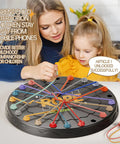 Mother and daughter playing Rope Untangling Puzzle Game For Kids And Adults, Educational Strategy Board Game with colorful ropes