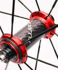 Close-up of carbon fiber tube hub on 700C Road Bike Wheelset 40mm Rim Depth Ultralight Aluminum Rim Quick Release Reflective Brake