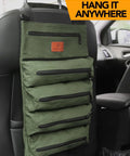 Sturdy Canvas 16oz Tool Roll Up Bag For Wrenches And Tools hanging on car seat with five zipper pockets, green color