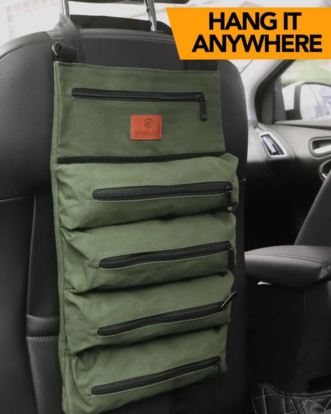 Sturdy Canvas 16oz Tool Roll Up Bag For Wrenches And Tools hanging on car seat with five zipper pockets, green color