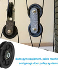 Close-up of Heavy Duty Nylon Pulley Wheels 4 Pack For Cable Machines And Gym Equipment featuring smooth bearings and steel inserts.