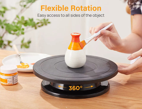 Person painting a ceramic on an 11 Inch Rotate Turntable For Cake Decorating And Painting With Smooth Ball Bearing Spin And 360 Degree Rotation Black Lightweight Display Stand For Spinning Spraying Decorating And Sculpting Projects By Kootek.