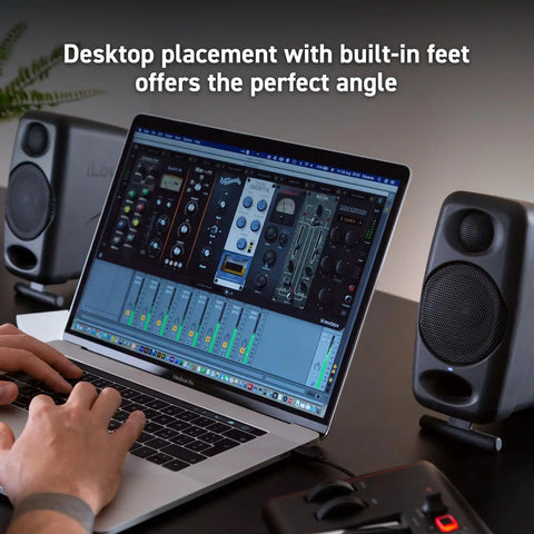 Ultra Compact 50W Wireless Bluetooth Studio Monitors Dual Reference Speakers for Music Production on desk with laptop