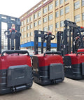 Walk Behind Powerhouse Electric Stacker Truck With Heavy Duty Hydraulic Lift For No Sweat Warehouse Loading And Smooth Material Handling Every Single Operation, showing multiple units parked.