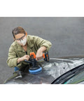 Person using Matrix 20V Max Buffer Kit For Cars Floors And Furniture With 3500 RPM Random Orbital Polisher on car hood